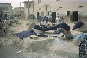 Cloth is still dyed in traditional ways by the Hausa people at the dye pits in Kano, Nigeria.
