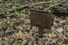 Old rusted metal temporary grave marker